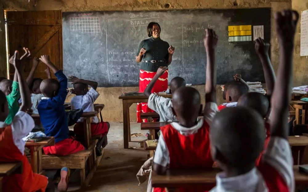 Nurse Agnes Akoth teaches children about malaria in a school in Kenya.