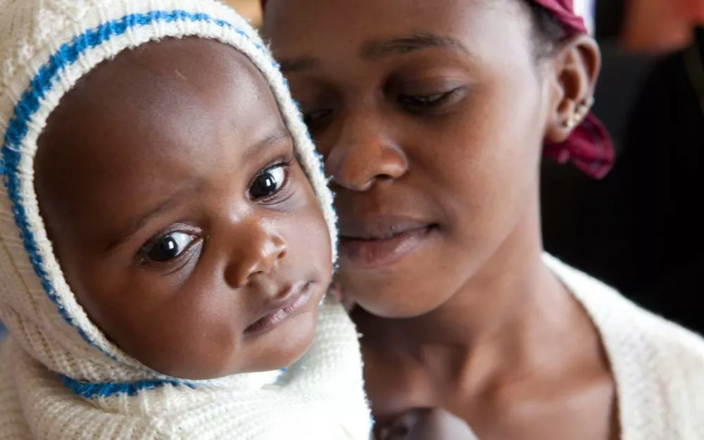 Mother with child in malaria-endemic Sub-Saharan Africa where effective treatment is needed.