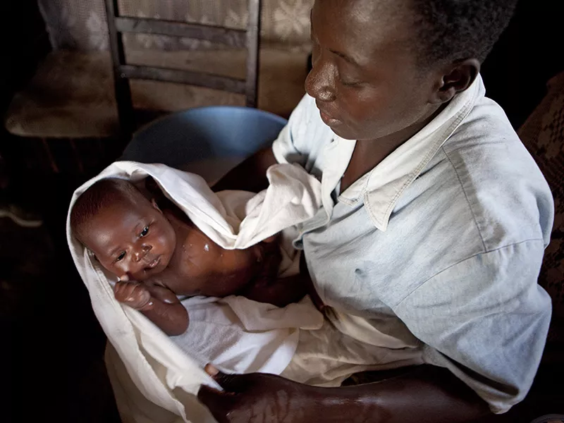 Nurse looking after baby in Kisumu, Kenya