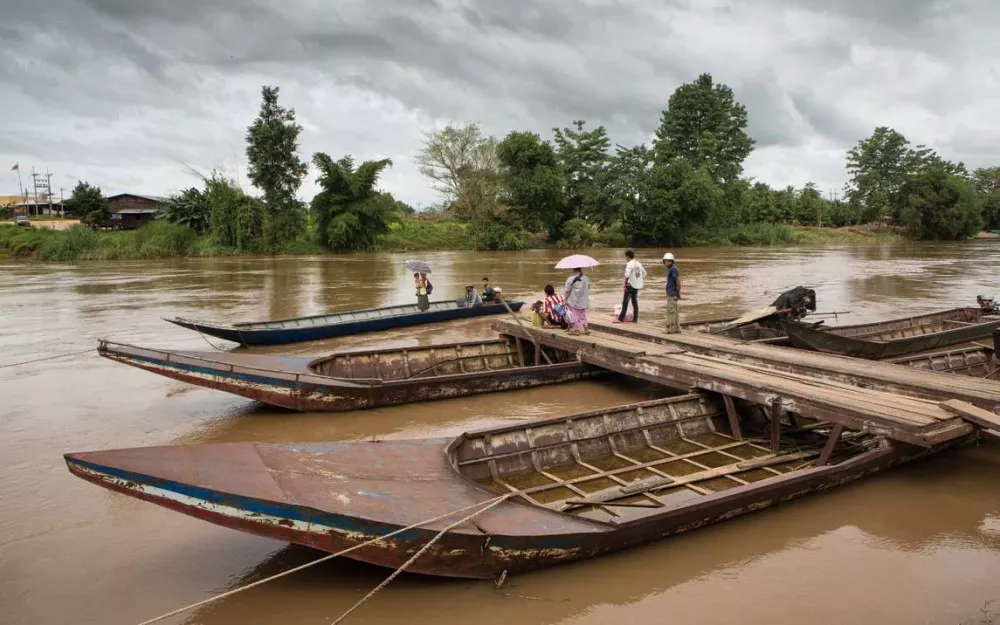 Boats on a river on border between Thailand and Burma, where resistance to artemisinin has been detected.