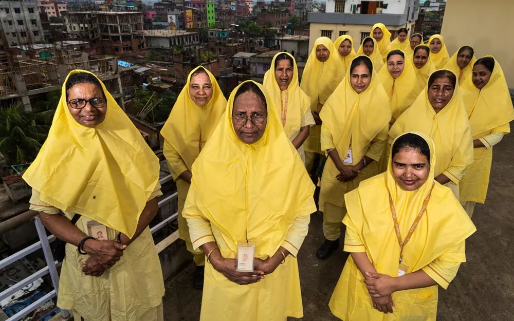 Yellow-robed health workers routinely visit homes in poor neighborhoods in Dhaka, Bangladesh as part of an ongoing fight against child pneumonia.  