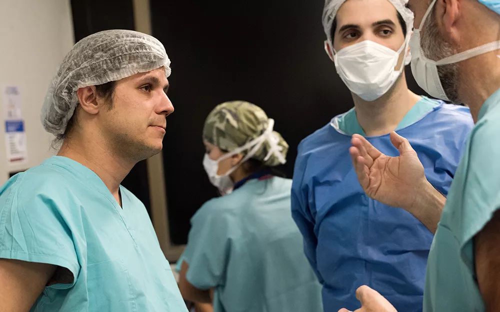 Transplant surgeon in Argentina confers with colleagues