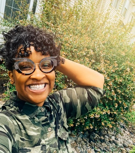 ITP patient smiling and wearing glasses