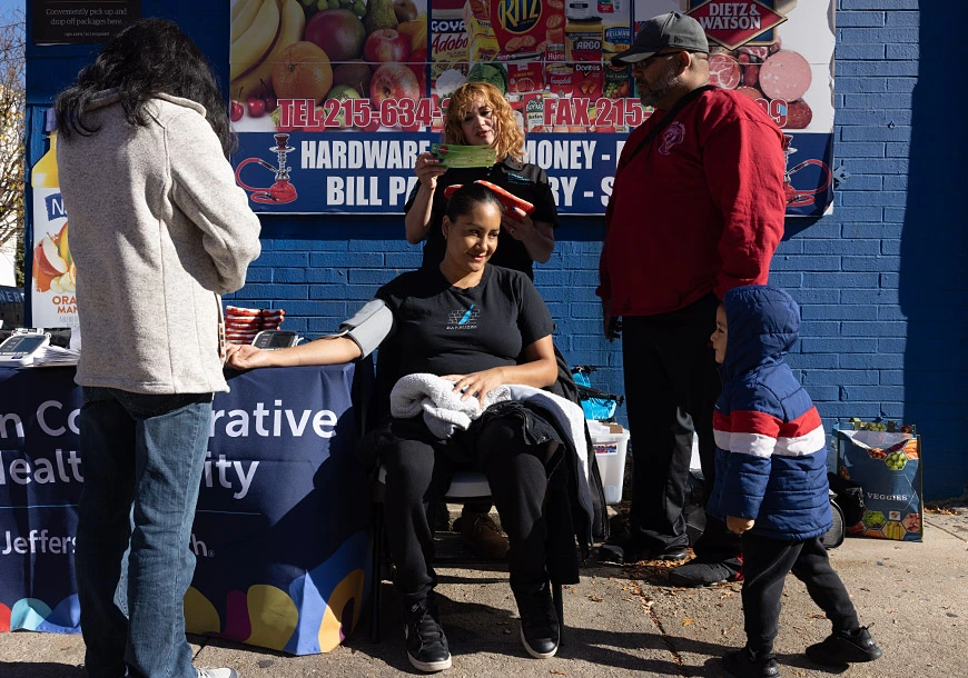 Maggie Perez (standing, center), a health educator in Philadelphia