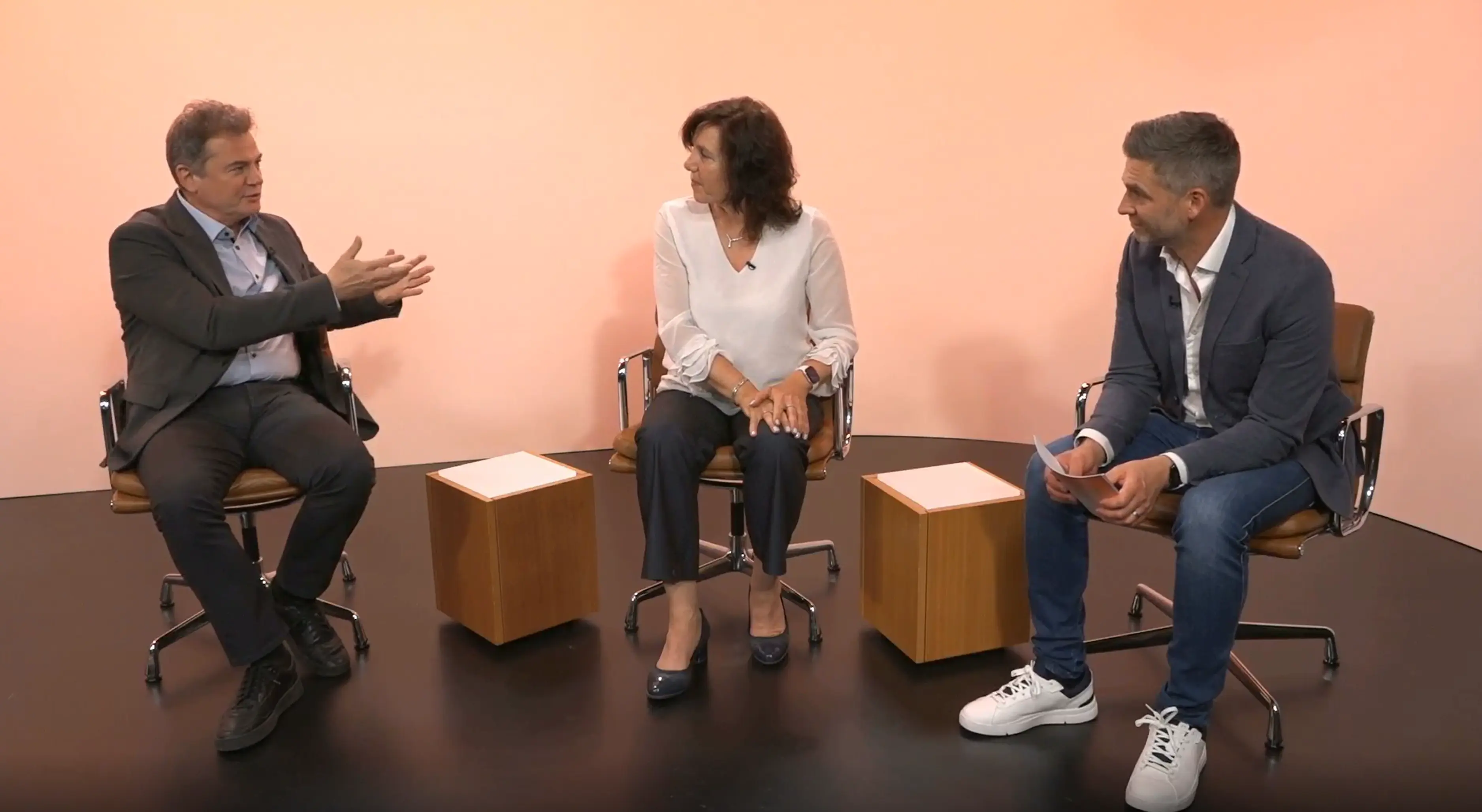 Peter Gergely (left) and Angelika Jahreis (center) in conversation with Max Lawson of Novartis. The group discussed technological advances that are opening the door to new approaches to treating immune-mediated diseases.