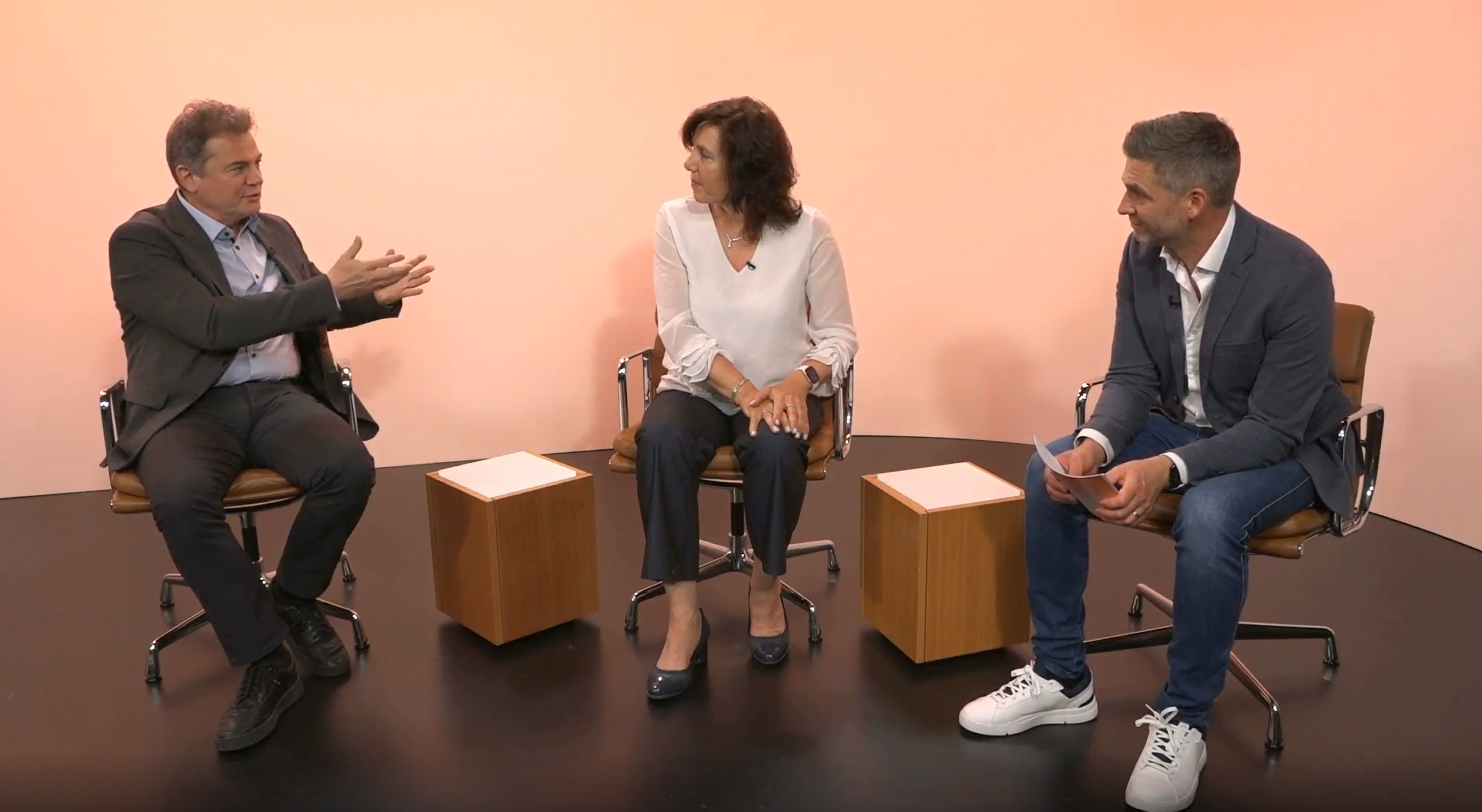 Peter Gergely (left) and Angelika Jahreis (center) in conversation with Max Lawson of Novartis. The group discussed technological advances that are opening the door to new approaches to treating immune-mediated diseases.
