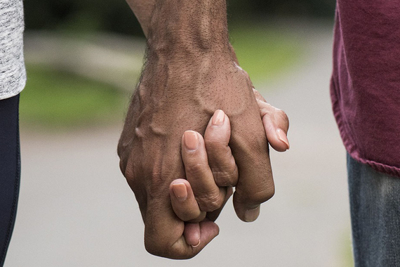 Couple holding hands