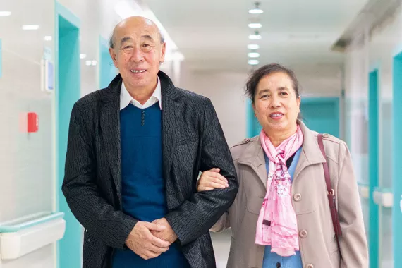 Jian Zhang (left), a patient with heart failure, and his wife leave a hospital in Shenyang, China