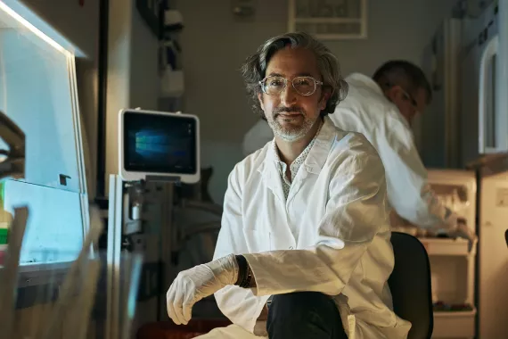 Scientist kneeling in a lab