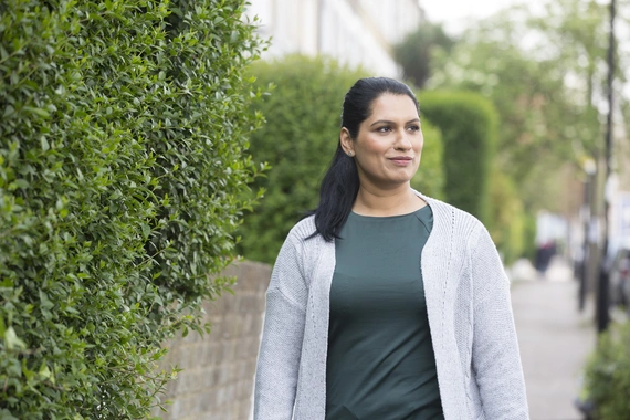 Kidney disease patient walks to her appointment with her