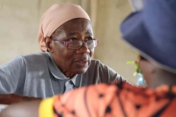 Sister Martine，a trained nurse，dispensing medicine at the Catholic mission’s health center in Ntui，Cameroon。