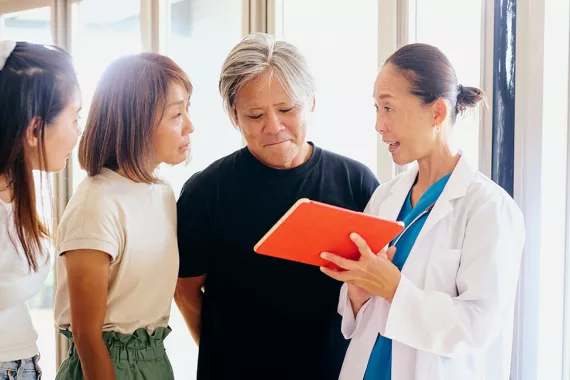Japanese doctor and patients discussing illness