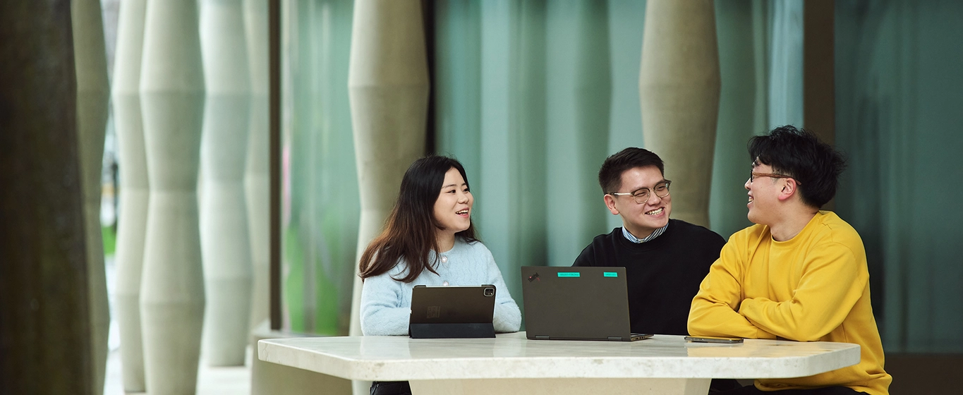 Three business people talking