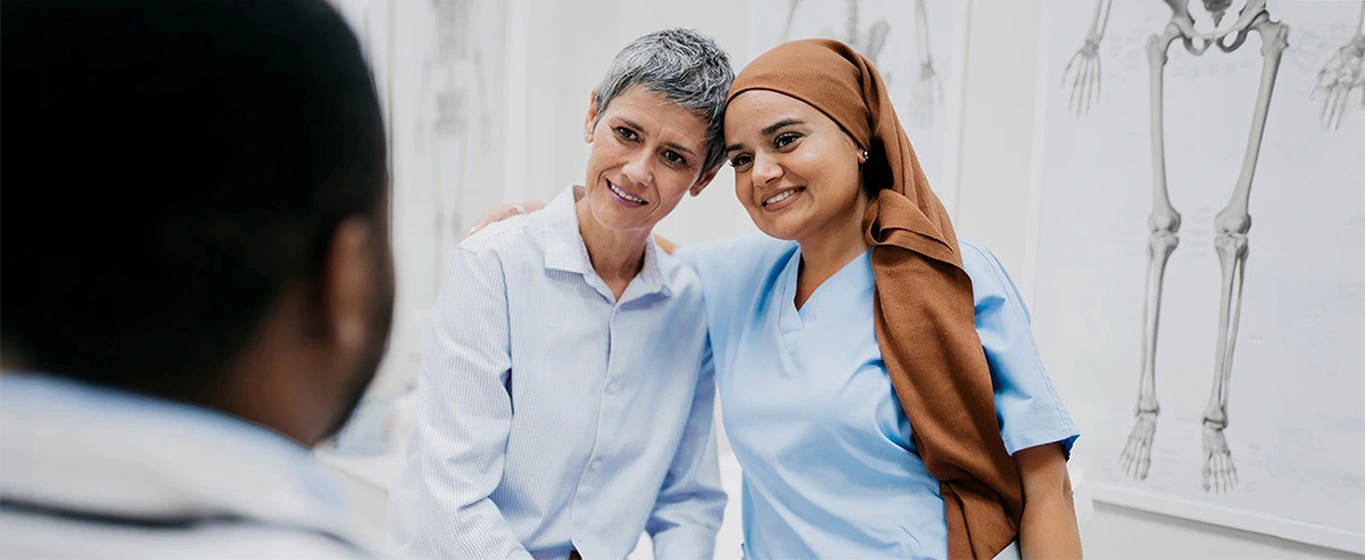 Nurse and patient exchanging a warm moment