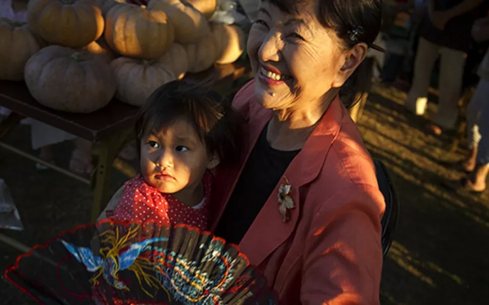 Kiku Taiza, 81, holds her great-granddaughter