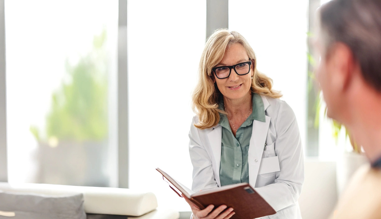Doctor discussing illness with patient in an office