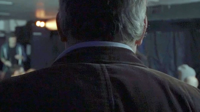 Comedian Toby Hadoke prepares to speak with an audience about psoriasis