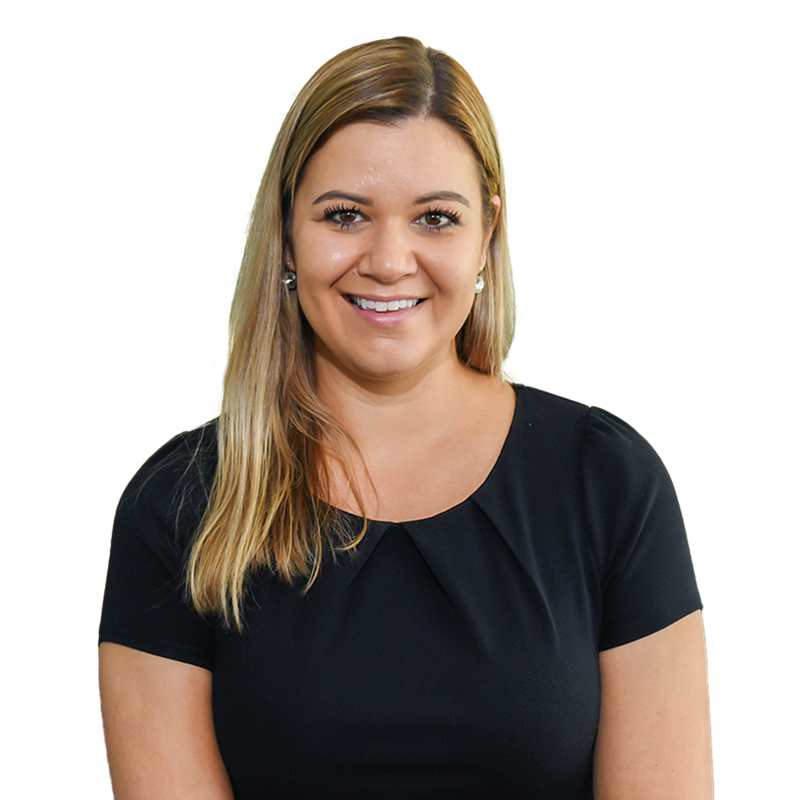 A woman smiling, looking into the camera