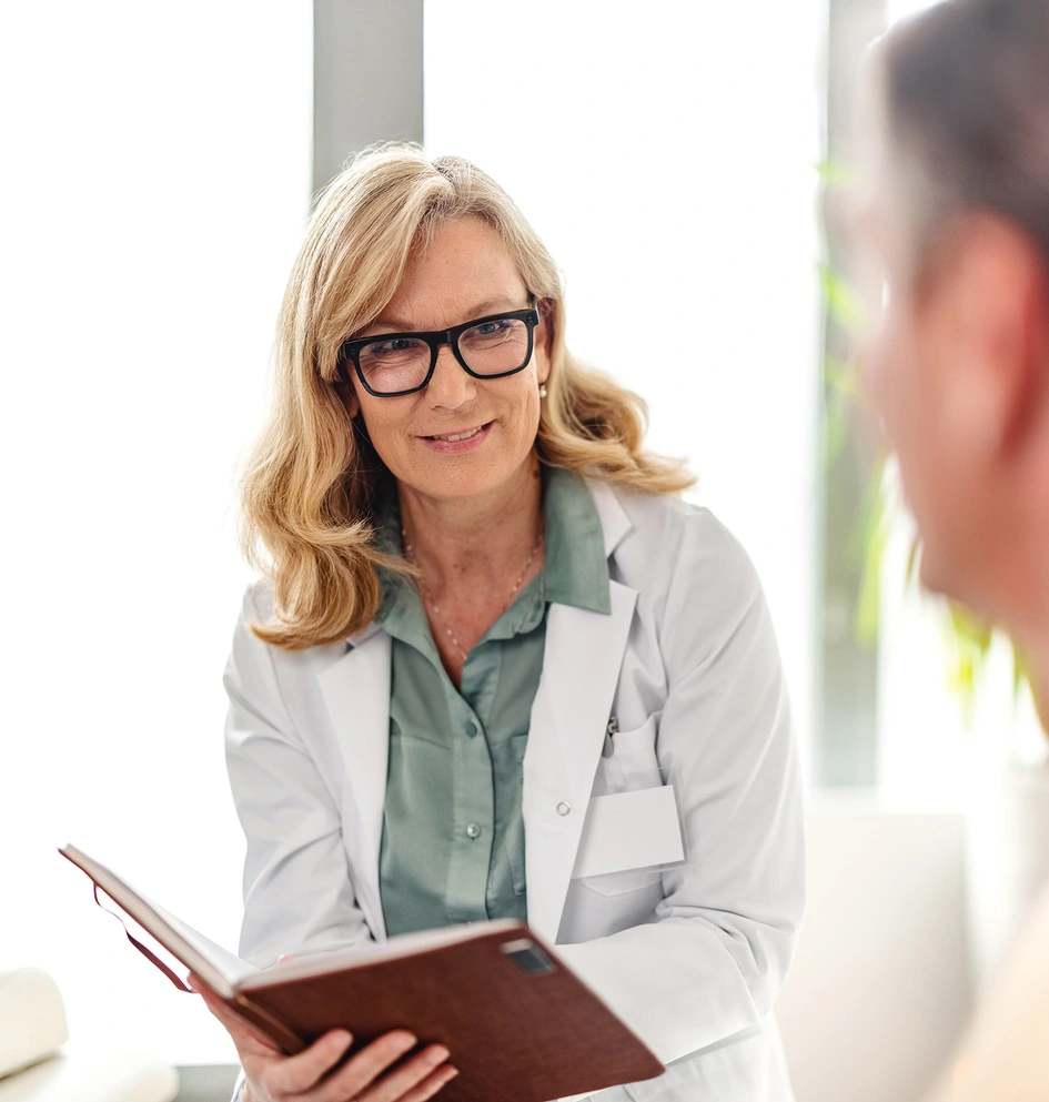Doctor discussing illness with patient in an office