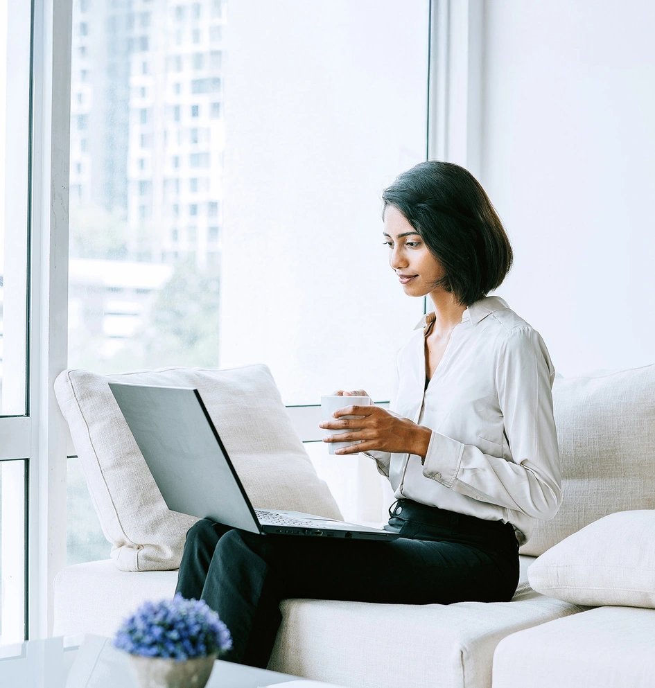 Business woman working on her laptop in a bright atmosphere