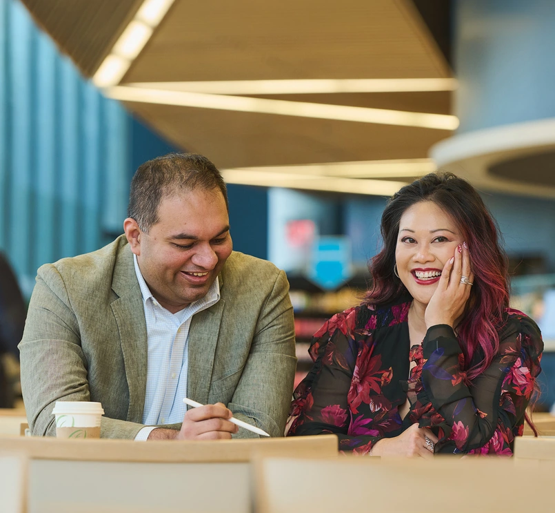 Two business people smiling