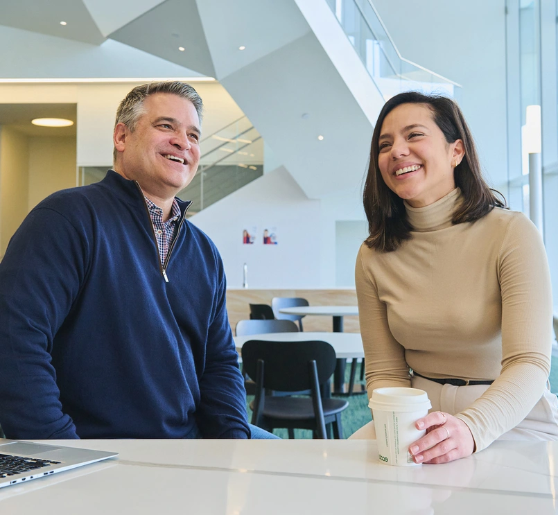Two business people smiling
