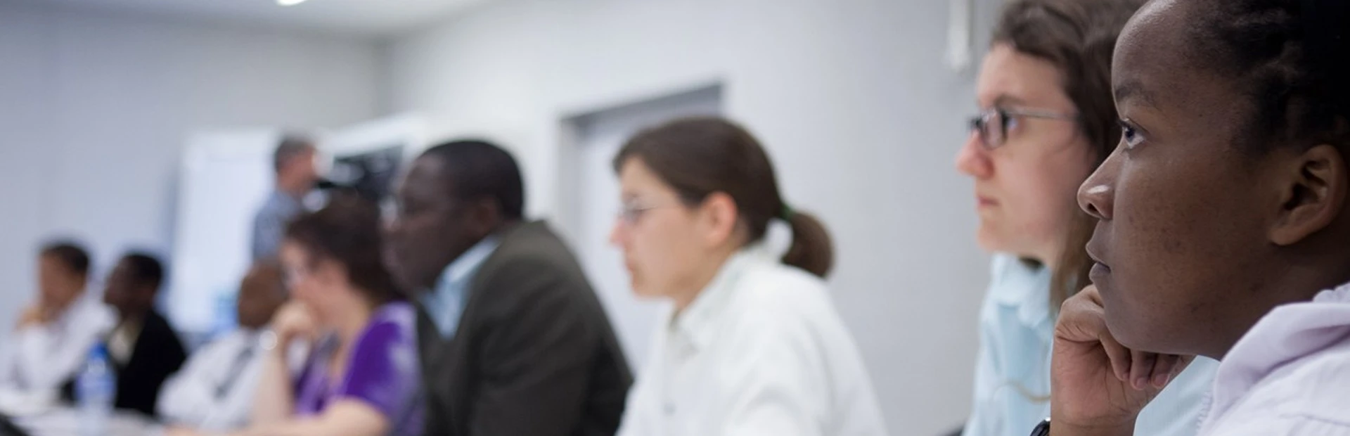 Dr. Thandiswa Ngcungcu listens to a seminar on drug discovery.