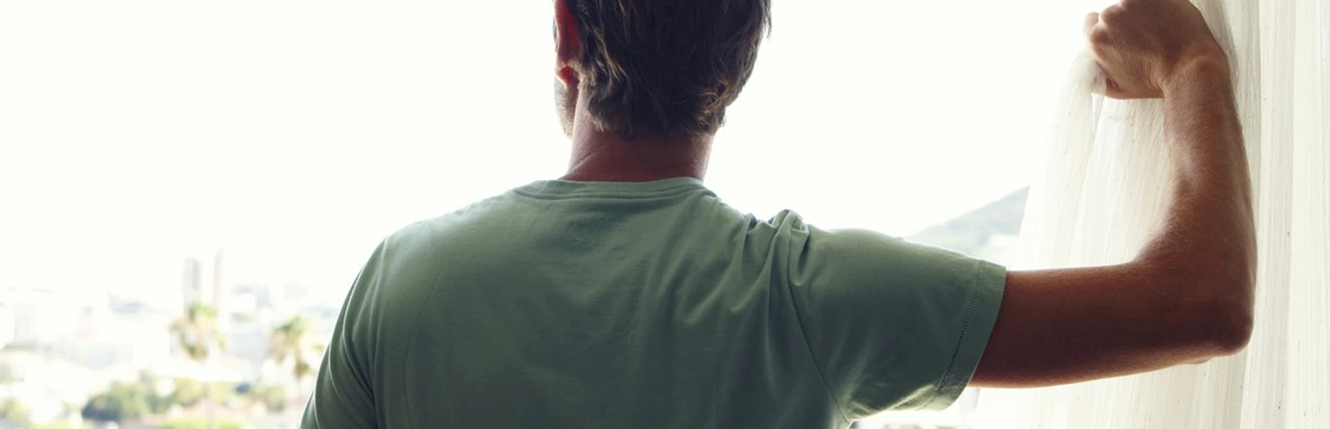 Man looking out of a window