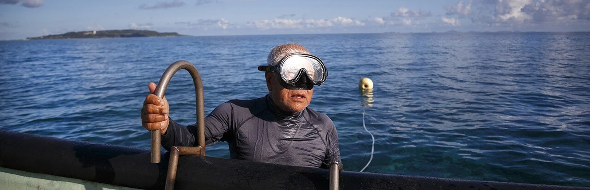 Tomi Miagi going out of the water after diving