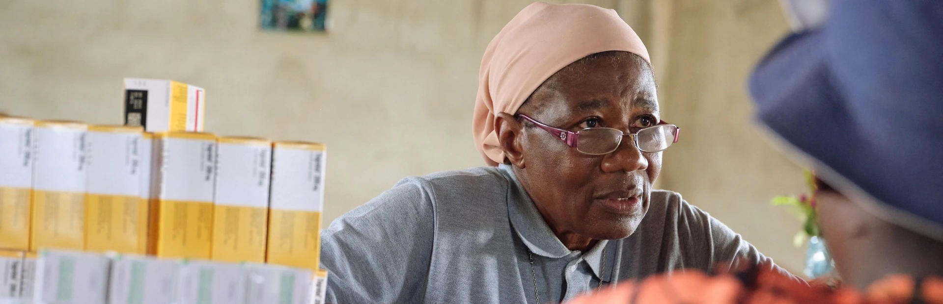Sister Martine, a trained nurse, dispensing medicine at the Catholic mission’s health center in Ntui, Cameroon.