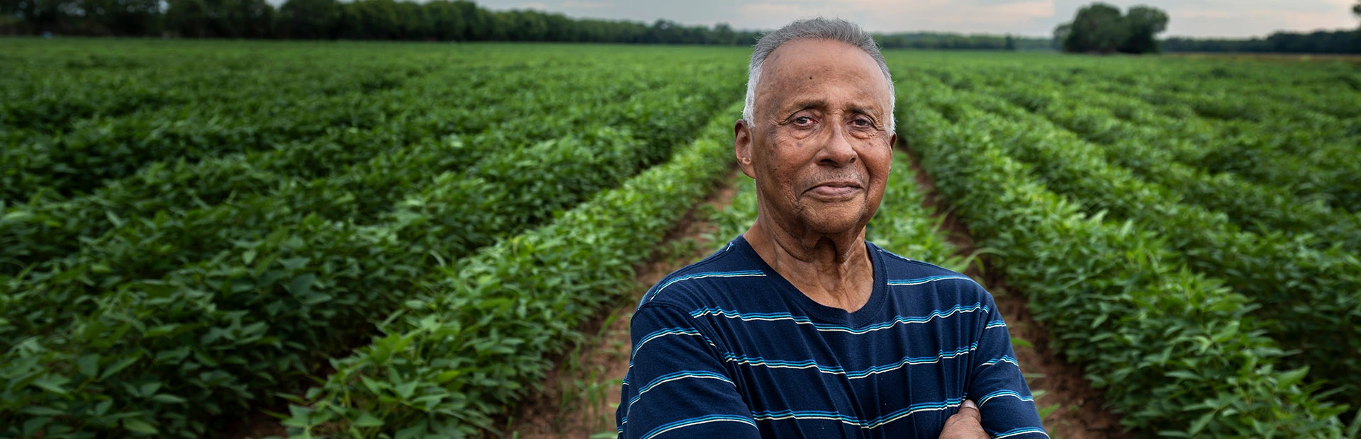Van Lacour standing in front of plantation.