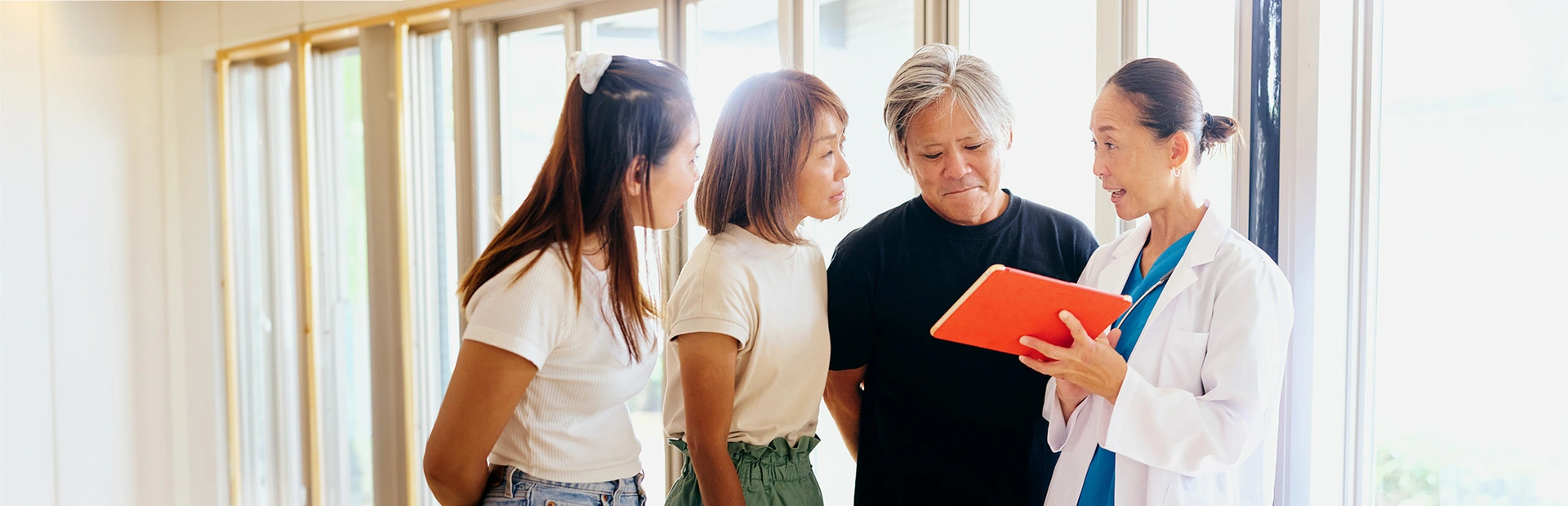 Japanese doctor and patients discussing illness