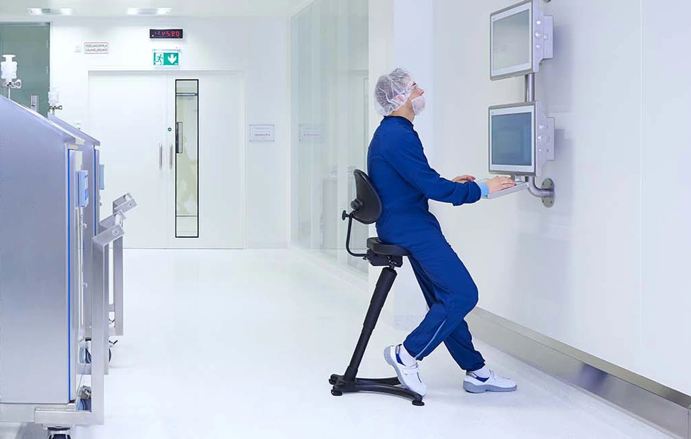 Production specialist working on a computer