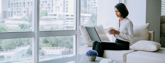 Business woman working on her laptop in a bright atmosphere