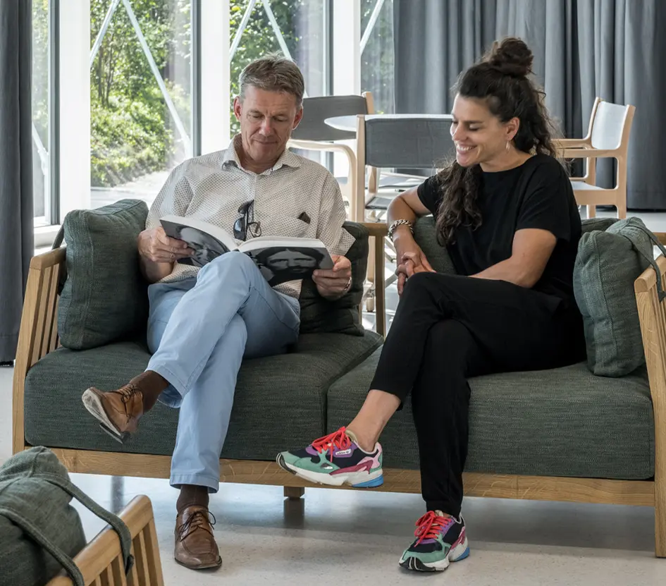 People relaxing on couches