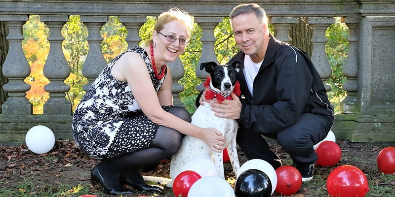 Alexandra Bach-Weidmuller and her husband caring for a dog