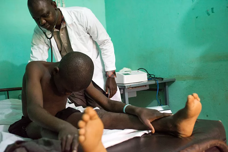 A trial participant undergoes a checkup at the Bougoula-Hameau health clinic