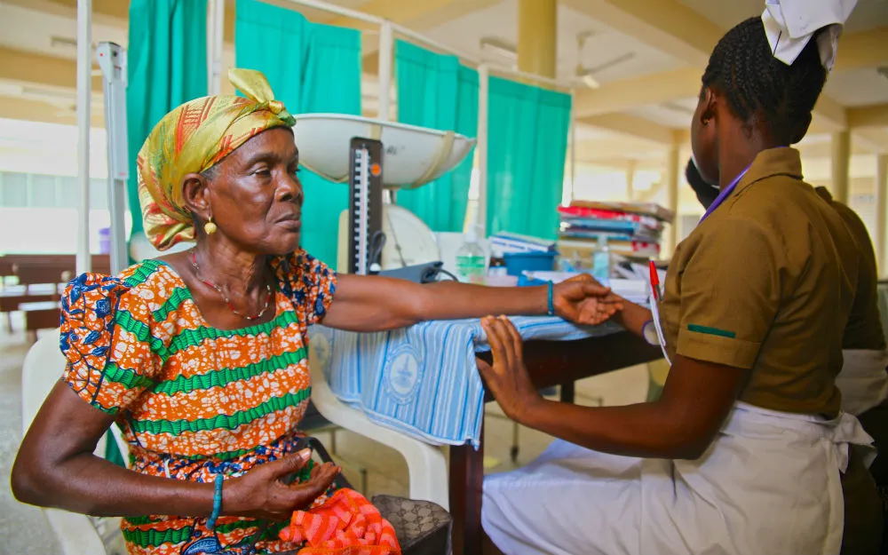 A woman at St. Martin’s Hospital has her blood pressure monitored.
