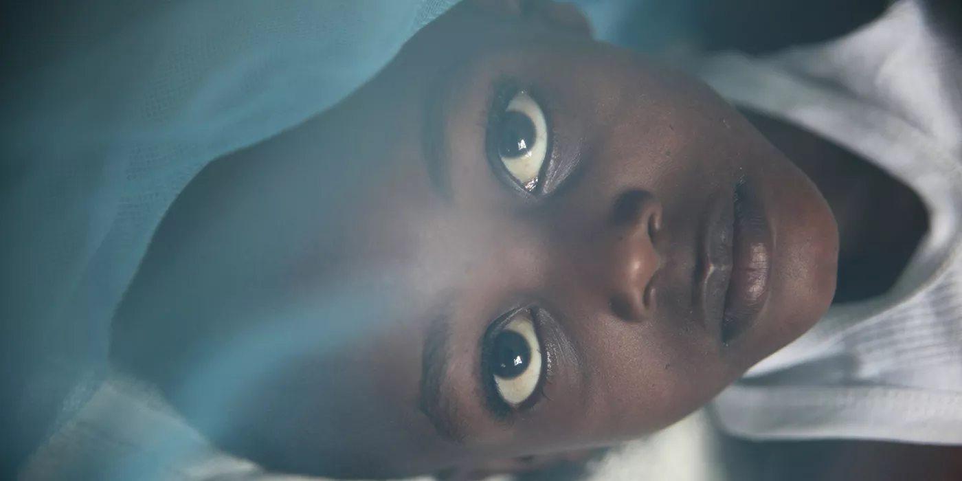 Young boy in hospital with malaria, Kenya.