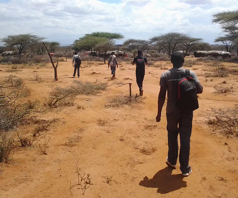 Field officers preparing to survey households in rural Kenya.