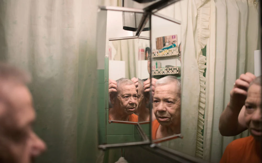 Ms. Hernández and her son inspect her new haircut.
