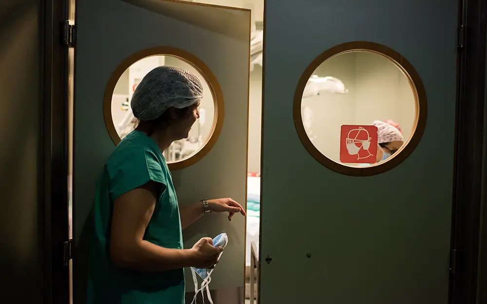 Transplant surgeon preps for surgery