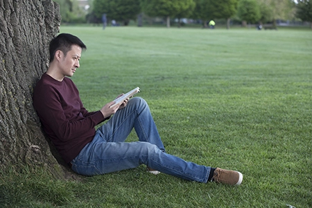 Kidney disease patient rests in a park