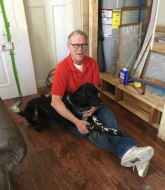 Portrait of Keith with his dog