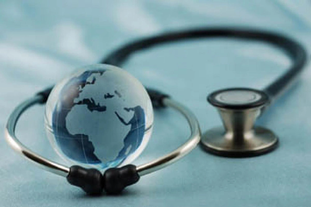 Illustration of a stethoscope around a globe