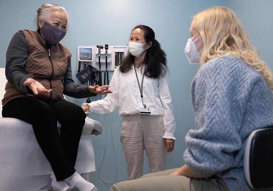 Tammy Ly (center), a community health worker in Philadelphia