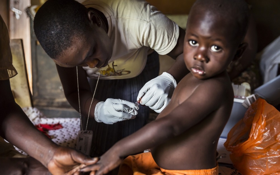 Young boy get treated against Malaria