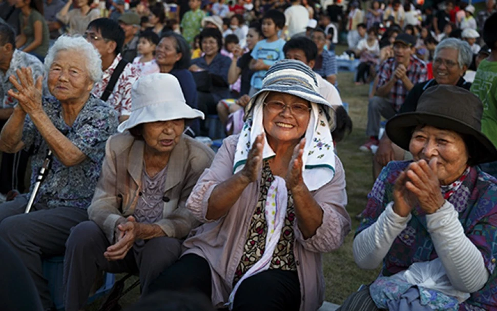 Take Yamashiro, 89, sits among friends