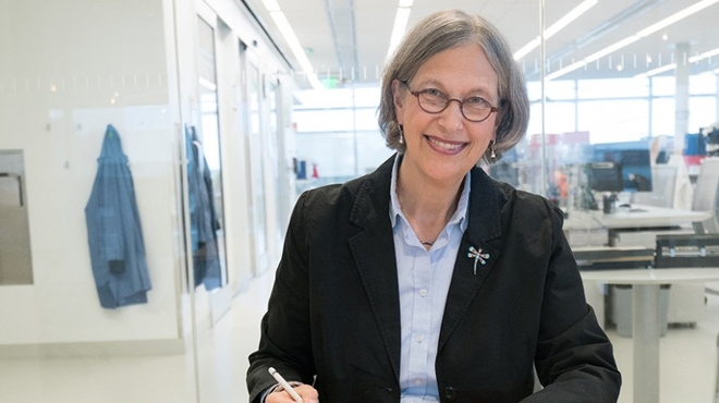 Cyndy Grosskreutz takes a moment to review projects