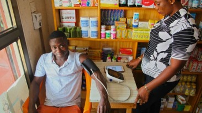 Raphael, 24, got his blood pressure tested when he dropped into a local shop. Shopkeeper Dorothy has been trained to conduct the blood pressure screening.
